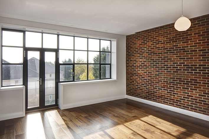 Industrial loft development. Loft-style windows and exposed brick